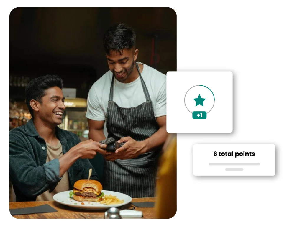 Waiter using a handheld device to take orders